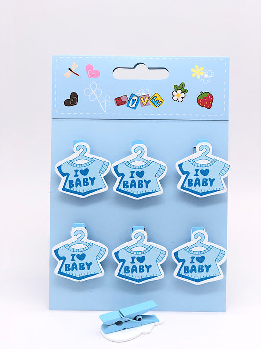 White baby shower dress decoration with clip, suitable for gender-neutral themes.